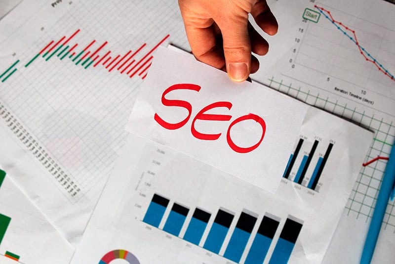 Image used for a home builder SEO audit checklist article, showing SEO reporting visuals, charts, and performance analysis for builders.